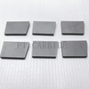 Solid tungsten carbide scraper for centrifuges 